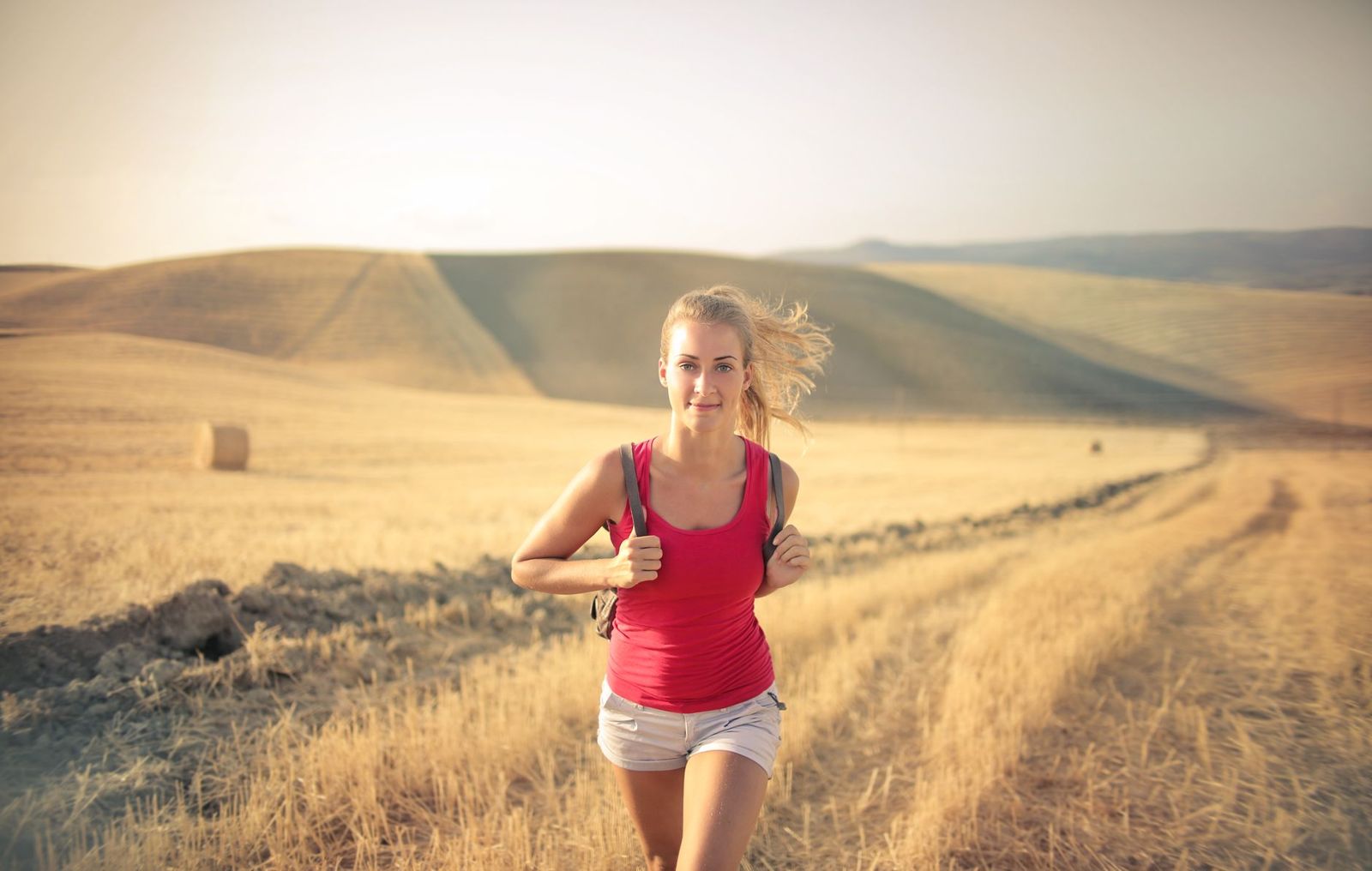 A person running outdoors at sunrise
